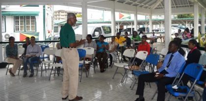 CEO od Amy's Pomeroon Foods Inc. Mr Louis Holder engaging those attending the coffee tasting exercise .JPG-june16