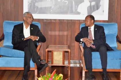 President David Granger conversing with Ambassador George Talbot at the Ministry of the Presidency