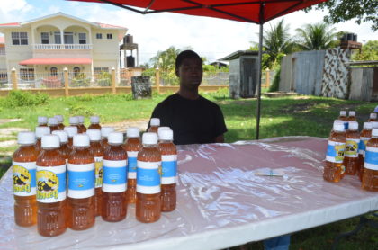 Akeem Williams with some of his honey products