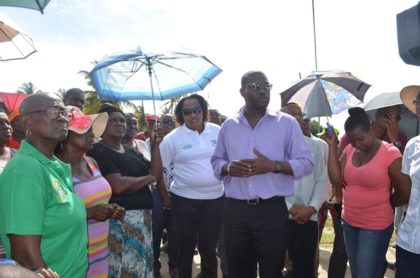 Minister of Public Infrastructure, David Patterson along with Minister within the Ministry, Annette Ferguson listening to Region Five residents’ concerns