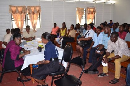 Minister within the Ministry of Communities, Valerie Sharpe-Patterson taking a rank through the process, at the Ministry of Communities-Department of Housing “Meet the Public,” exercise at the Leonora Police Station