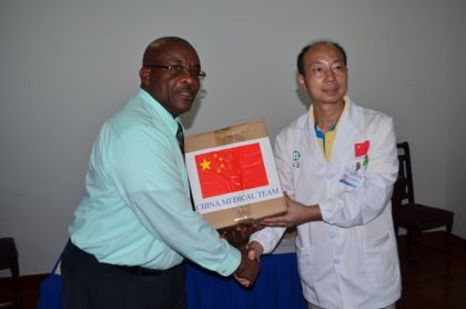 Dr. Wang Yongxiang, Head of the Chinese Medical Brigade handing over the medical equipment to Colin Bynoe, Chief Executive Officer (CEO) of the New Amsterdam Hospital