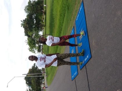 Director of Sport, Christopher Jones and Guyanese Gold Medalist, Alicia Fortune walking to raise awareness of Sickle Cell