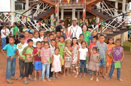 President David Granger and First Lady Mrs. Sandra Granger with the children of Surama Village who came out to greet them 