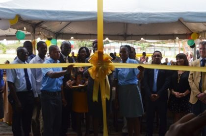 Officials of the TVET Department of the Ministry of Education, LTI, MACORP and the College of the North Atlantic cut the ribbon to officially open LTI’s new automotive workshop