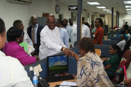 Finance Minister Winston Jordan meets a staff of the Guyana Revenue Authority during a visit to the agency