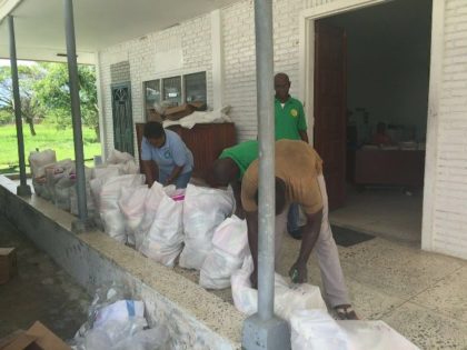 CDC officials preparing hampers for distribution in Moraikobai over the weekend.