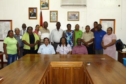 Minister of Social Protection Volda Lawrence and Minister within the Ministry, Keith Scott, Region 9 Chairman, Brian Allicock, Member of Parliament, Desmond Adams, Chief Social Services Officer, Ricardo Banwarie and Mayor of Region 9, Carlton Beckles flanked by members of the Region 9 Board of Guardians 