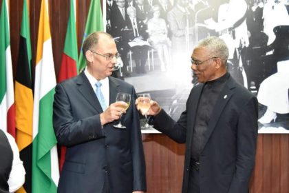 President David Granger shares a toast with Ambassador Kim Højlund Christensen after the accreditation ceremony, this morning at the Ministry of the Presidency
