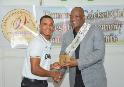 West Indies Under 19 Player, Tevin Imlach receiving his Award from Minister of State, Mr. Joseph Harmon during last evening's Awards Ceremony at the Demerara Cricket Club