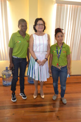 First Lady, Mrs. Sandra Granger is flanked by, from left, Ms. Collet Hope and Ms. Carrin Carter, both representatives of the Guyana Rugby/Football Union