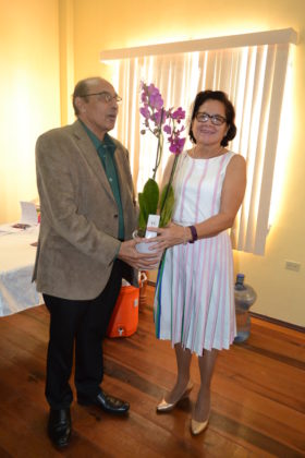 Mr. K.A. Juman-Yassin presents First Lady, Mrs. Sandra Granger with an orchid in appreciation for her attendance at the GOA’s Women in sport Seminar, this morning