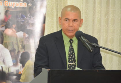 Minister of Public Health, Dr. George Norton, during his remarks at the World Population Day Symposium