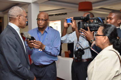President David Granger speaking with media operatives, earlier today, at the Thirty Seventh Regular Meeting of the Conference of the Heads of Government of the Caribbean Community at the Pegasus. (GINA photo)