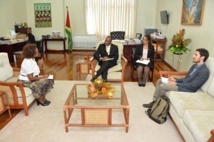 Minister of State, Mr. Joseph Harmon, in discussion with Mr. Fabio Oliva and Ms. Khadija Musa, during their meeting at the Ministry of the Presidency, earlier today