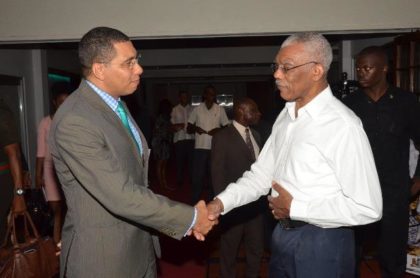 President David Granger and Prime Minister Andrew Holness greeting each other a the Pegasus Hotel this afternoon just before they sat down for bilateral talks.