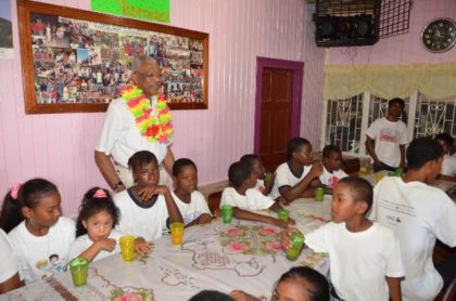 President David Granger and some of the children of the Hope Children’s Home at the book presentation held there, this morning, in honour of his 71st birthday