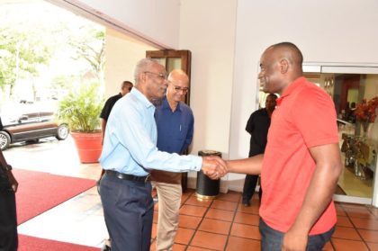 President David Granger exchanges a handshake with the Prime Minister Roosevelt Skerrit upon his arrival at the Pegasus Hotel, this morning, for a Breakfast meeting
