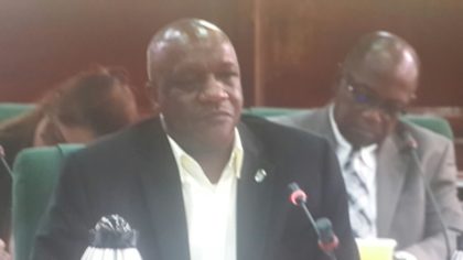 Minister of State Joseph Harmon responding to questions from the Parliamentary Sectoral Committee on Natural Resources, at Parliament Chambers