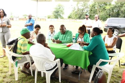 Minister of State, Joseph Harmon attending to residents’ concern 