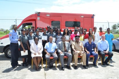 Graduates of the Emergency Medical Technician (EMT) course. Seated in front (L-R) are Ministry of Public Security’s Permanent Secretary, Danielle McCalmon, Director of Medical and Professional Services at the GPHC, Dr. Sheik Amir, Public Security Minister Khemraj Ramjattan, Fire Chief, Marlon Gentle, National Emergency Medical Director Dr Zulficar Bux and Vanderbilt University Representative, Dr Shannon Langston 