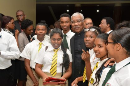 President David Granger grants a photo opportunity to these students, who attended the Opening Ceremony of the CARICOM Heads of Government Meeting