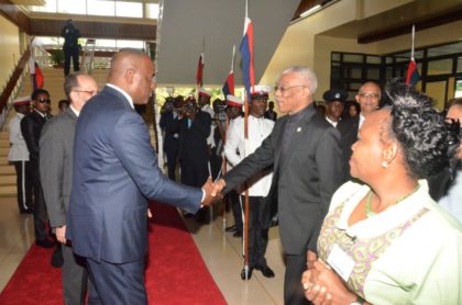 President David Granger, co-host of the Thirty Seventh Regular Meeting of the Conference of Heads of Government of the Caribbean Community (CARICOM) greets current CARICOM Chairman and Prime Minister of Dominica, the Right Honourable Roosevelt Skerrit upon his arrival at the National Cultural Centre for the Opening ceremony