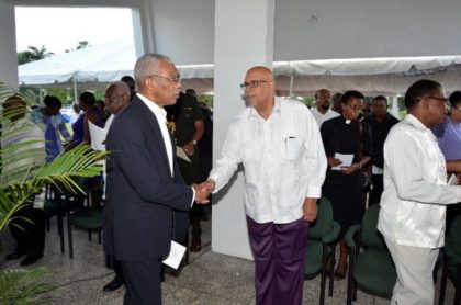 President Granger greeting Dr. Richard Van West Charles, the son-in-law of the late Forbes Burnham 