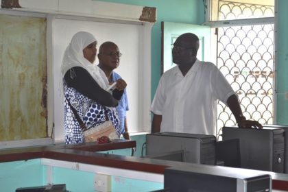 Presidential Advisor on eGovernment and Head of the eGovernment Agency, Mr. Floyd Levi (centre) and Director of the connectivity aspect of the project, Mr. Phillip Walcott listen as Dean of the IT Department of the Skeldon Line Path Secondary School, Ms. Wafeeya Razak explains some of the issues challenging the smooth running of the department.