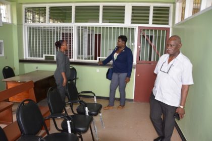 Minister of Citizenship, Mr. Winston Felix along with  Assistant National Director, Community Development Councils, Ms. Sandra Adams of Linden, examine the office within the National Insurance Scheme building  where the passport services will be conducted.