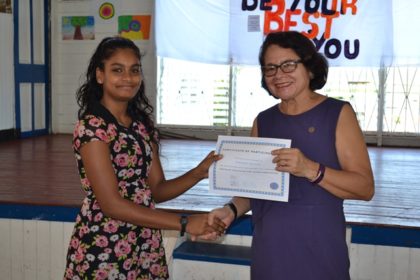 Ms. Amanda Karran accepts her certificates from First Lady, Mrs. Sandra Granger