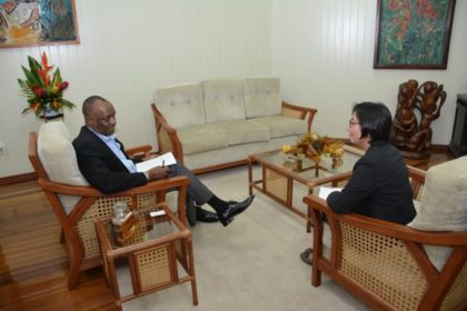Minister Harmon makes a point to Ms. Tanaka ,during their meeting this afternoon at the Ministry of the Presidency.  