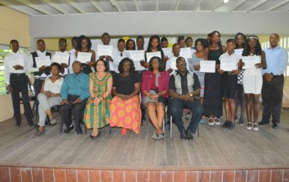 First Lady, Mrs. Sandra Granger, and facilitators, pose with the graduates from the ICT Training Programme