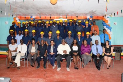 The batch of heavy- duty equipment operators pose with officials of the Board of Industrial Training (BIT), Office of the Presidential Advisor on Youth Empowerment and Ministers of Social Protection and other officials 