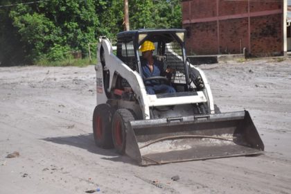 One of the young men display skills learnt during the period of heavy-duty machinery training 