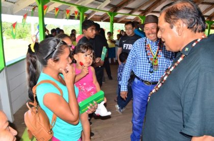 Prime Minister Moses Nagamootoo and Minister of Indigenous Peoples’ Affairs Sydney Allicock interacts with Surama residents 