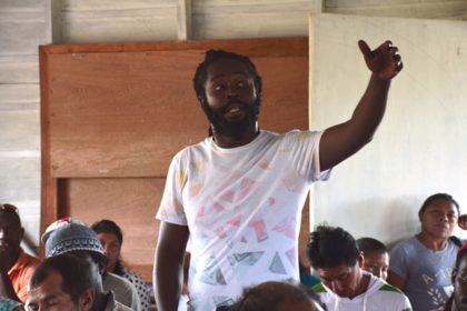 A resident of Imbaimadai raises a concern at the meeting with Minister of Natural Resources, Raphael Trotman