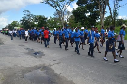 A section of the youths marching along Homestretch Avenue on International Youth Day 