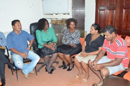 From left to right; Regional Health Officer Region Nine, Dr. Ronald Chowdry, Minister within the Ministry of Public Health Dr. Karen Cummings, Director of Regional Health Services Dr. Kay Shako, (mother of stillborn baby ) Christina Teloki, and a family member.