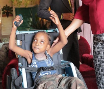 Little Alijah LaRose happy with his wheelchair gift