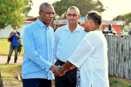 President David Granger is greeted  by Vice President and Minister of Indigenous Peoples' Affairs, Mr. Sydney Allicock upon his arrival at the National Exhibition Centre, Sophia, earlier this afternoon. 