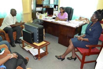 Chief Executive Officer of the eGovernment Agency, Mr. Floyd Levi met with the Regional Education Officer, Mrs. Baramdai Seepersaud (centre) to discuss the progress of the Secondary Schools Connectivity Project, which is part of the IDEAL programme 