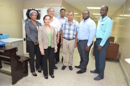 From left to right: Karen Lindore, Secretary to the Board of Directors, GPHC, Pavita Ramkissoon, Director of Internal Audit, Dr. Carl Max Hanoman Chairman, GPHC’s Board of Directors, along with other staff of the hospital; Dr. Ravi Motilall, Senior Surgical Registrar,  Michael Khan, Chief Executive Officer, Gerron Parker expenditure analyst, and Ronald Charles, Finance Director 