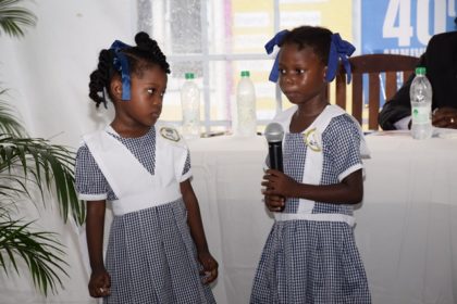 Two pupils of the East Ruimveldt Nursery School performing a poem at the 40th anniversary of the launch of the Guyana Nursery Education Programme at the Roxanne Burnham Nursery School
