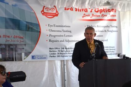 Minister of Public Health, Dr. George Norton giving the feature address at the opening ceremony of the branch of Da Silva’s optical, Parika