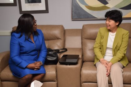 Minister within the Ministry of Public Health, Dr. Karen Cummings interacts with Vice Minister of the National Health and Family Planning Commission, China, Madam Cui Li