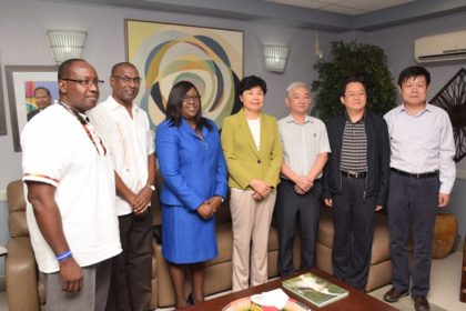 Public Health Officials, including Permanent Secretary Ministry of Public Health, Trevor Thomas, Chief Medical Officer Dr. Shamdeo Persaud and Minister within the Ministry of Public Health, Dr. Karen Cummings with Vice Minister Cui Li, Chinese Ambassador to Guyana, Zhang Limin, and members of the Chinese delegation in Guyana with the Vice Minister