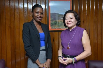 First Lady Mrs. Sandra Granger and Ms. Ms. Marcia Charles, who was awarded a scholarship at the London University of Economics and Political Science