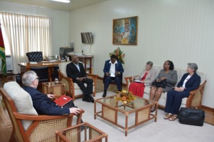 Minister of State, Mr. Joseph Harmon in discussion with the Canadian High Commissioner to Guyana and the Caribbean Leadership Project team.