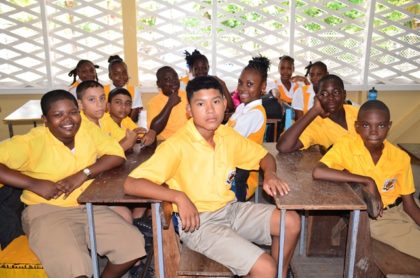 Brickdam Secondary School students in their new classroom